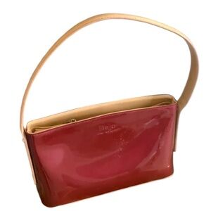 BEIJO top handle bag, maroon patent leather, tan trim, silver feet, zipper top.